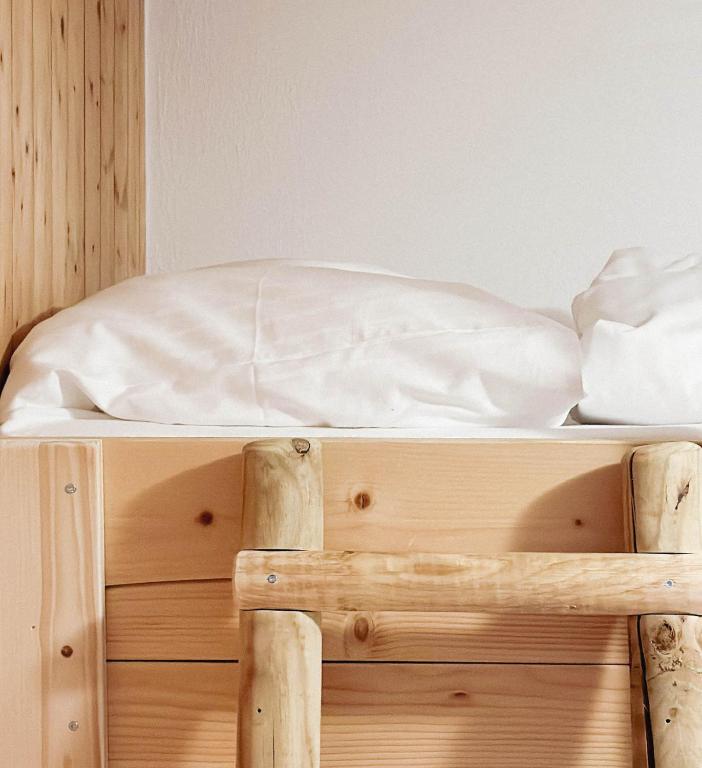 Postel nebo postele na pokoji v ubytování s´Amagmach