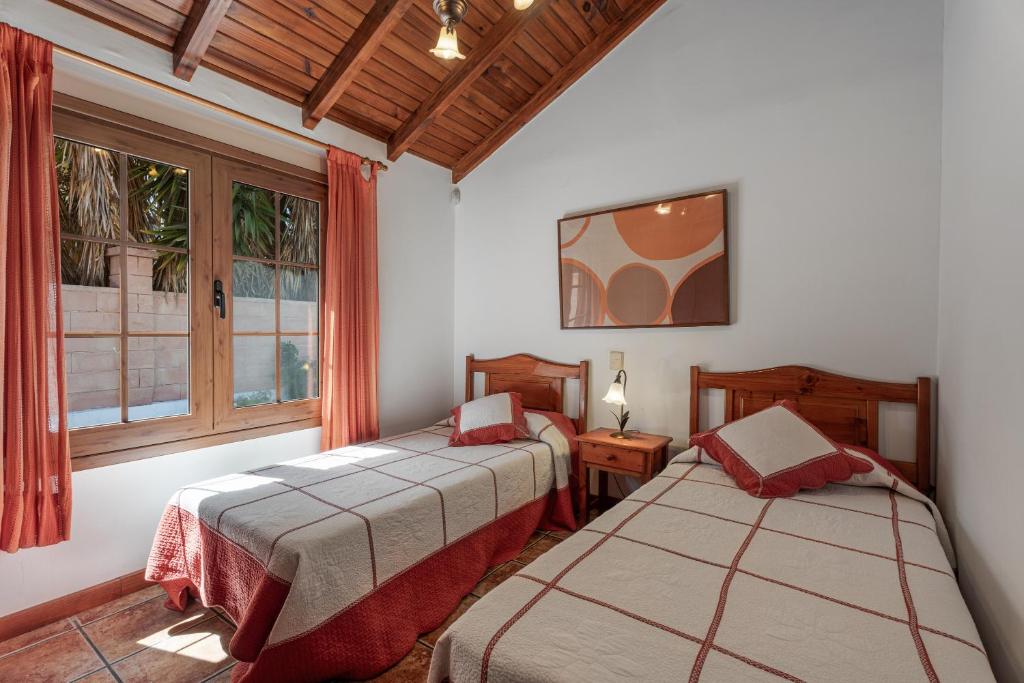 Ένα ή περισσότερα κρεβάτια σε δωμάτιο στο Casa La Molineta