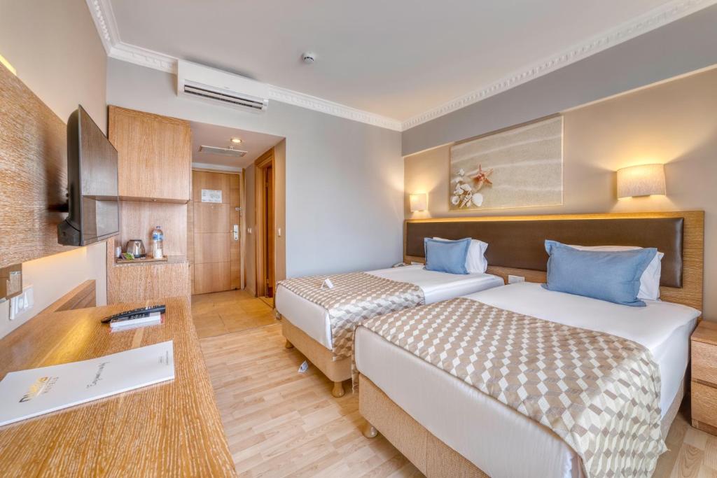 Postel nebo postele na pokoji v ubytování Numa Club Side Hotel - Ultra All Inclusive