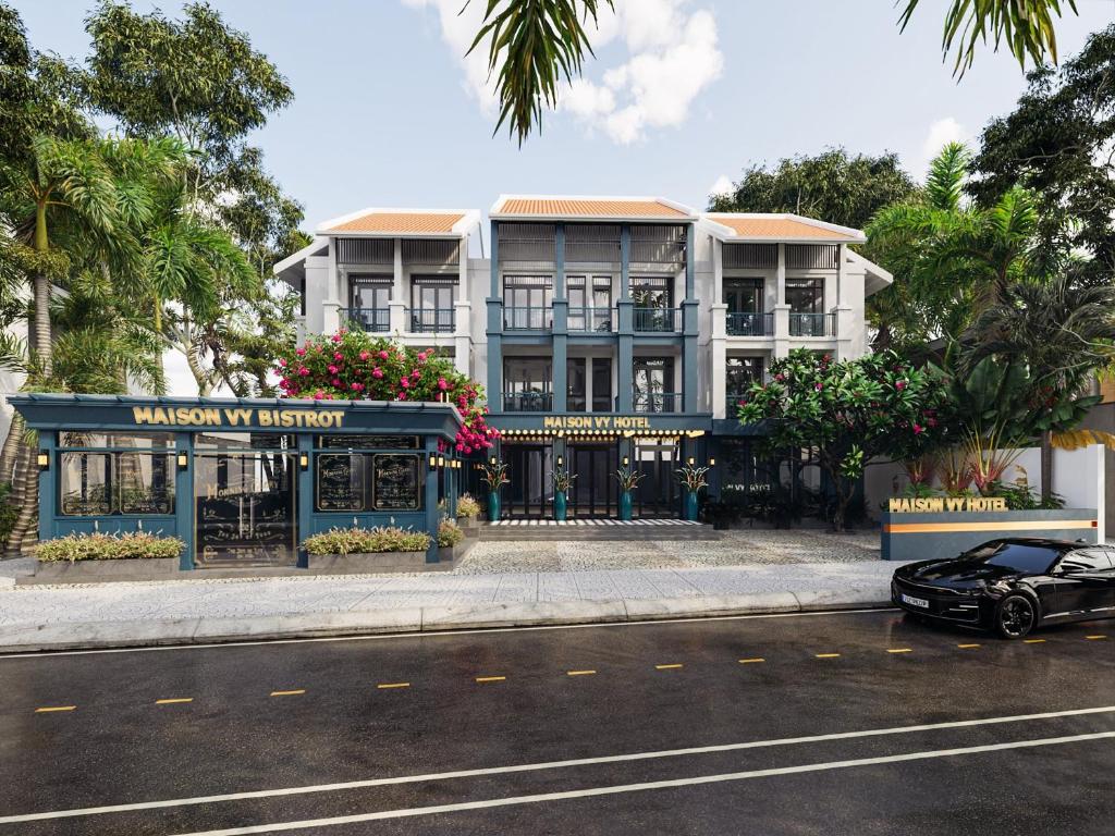 a black car parked in front of a building at Maison Vy Hotel Hội An in Hoi An