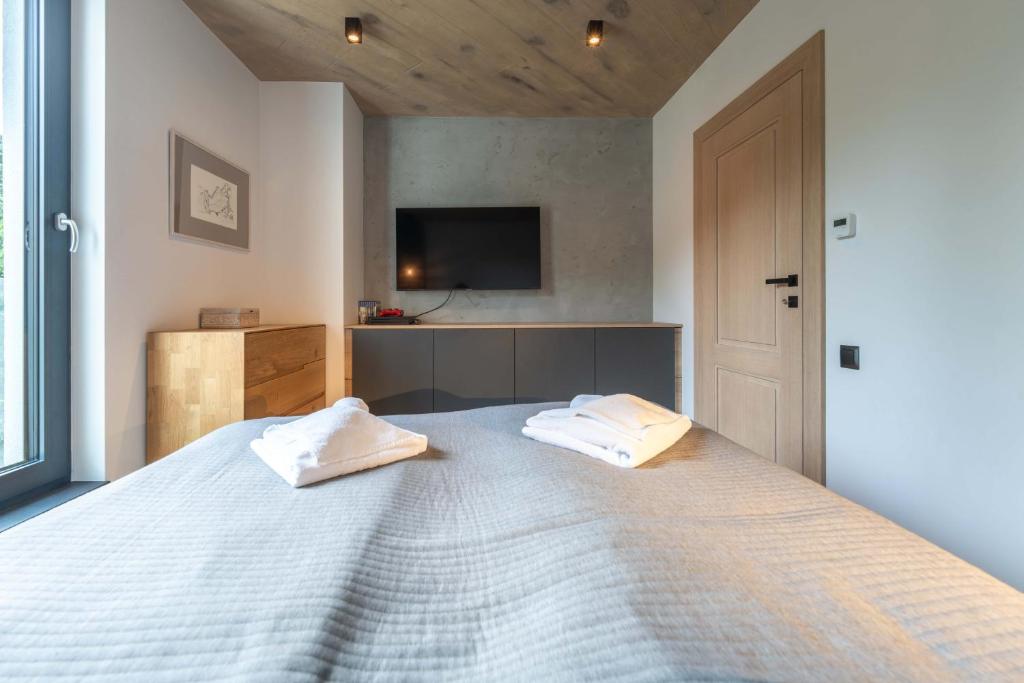 Postel nebo postele na pokoji v ubytování Apartamenty Kalinowa z sauną i bawialnią - Dream Apart