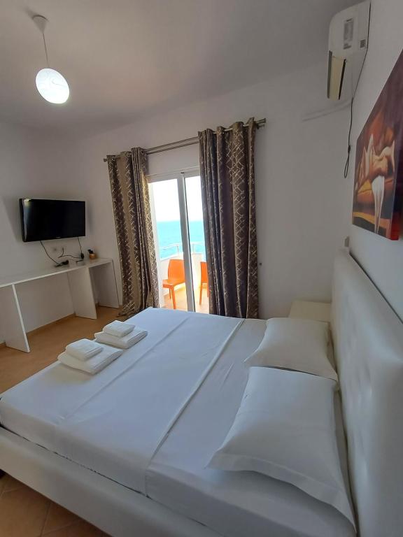 Postel nebo postele na pokoji v ubytování Hotel Sherifi