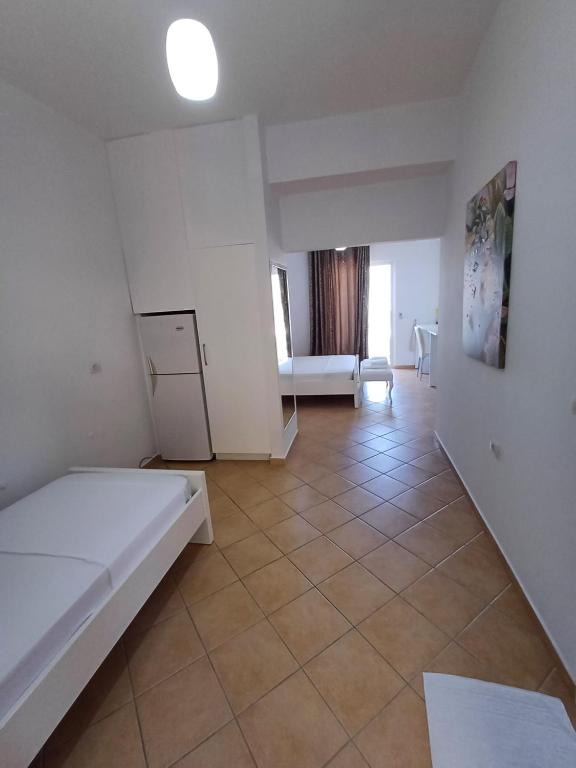 Postel nebo postele na pokoji v ubytování Hotel Sherifi