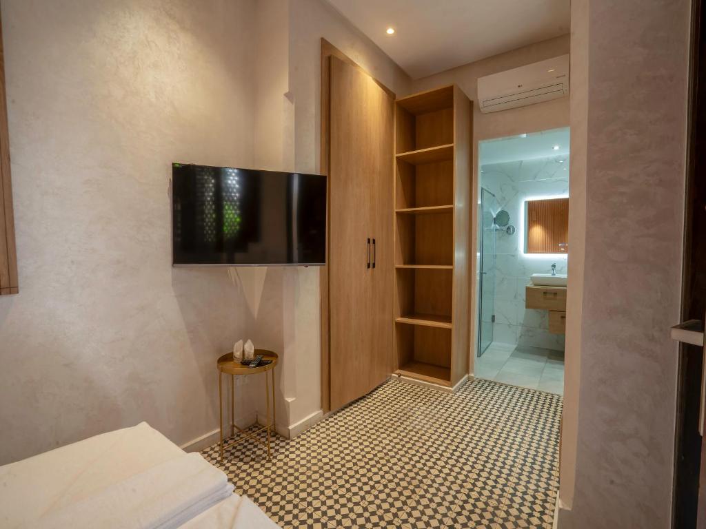 Postel nebo postele na pokoji v ubytování MAISON SOLANEOS