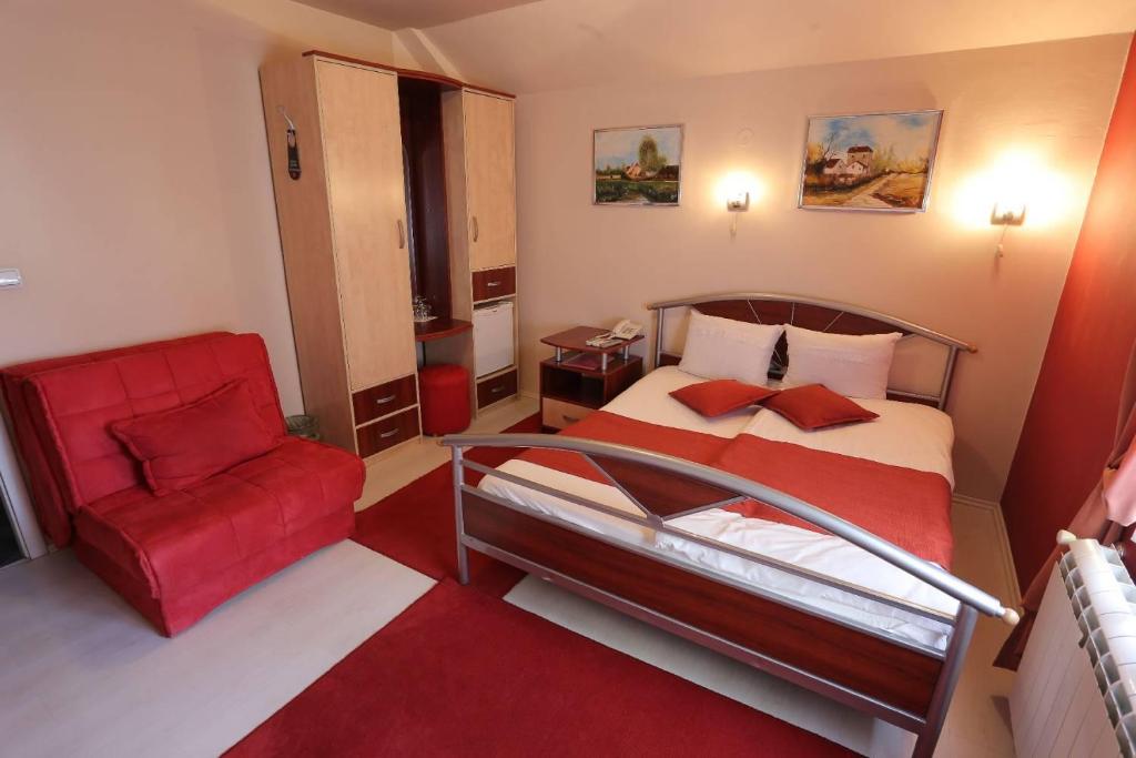 Postel nebo postele na pokoji v ubytování Hotel Ženeva