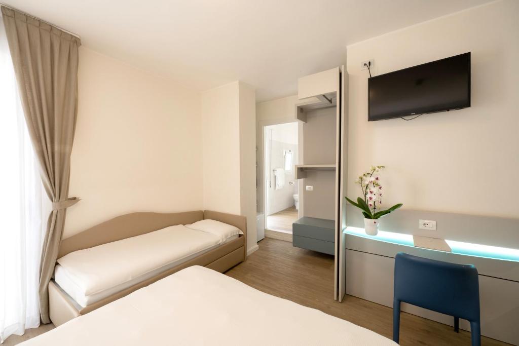 Postel nebo postele na pokoji v ubytování Hotel Astoria