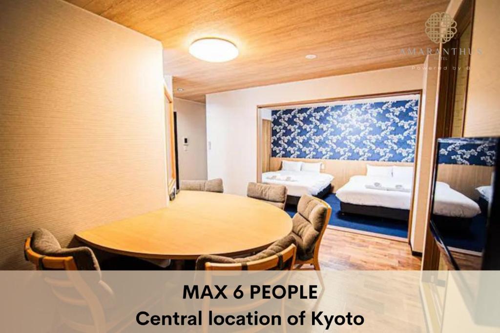 a room with a table and a room with two beds at Hotel Amaranth Kyoto Gojo - Vacation STAY 19876v in Kyoto