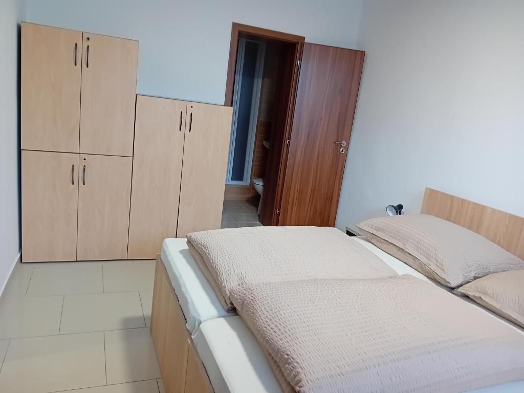Postel nebo postele na pokoji v ubytování Penzión Marcel