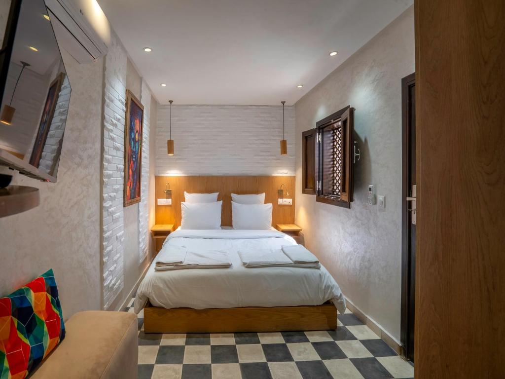 Postel nebo postele na pokoji v ubytování MAISON SOLANEOS