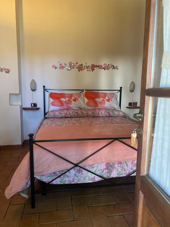 Łóżko lub łóżka w pokoju w obiekcie Agriturismo La Castellina