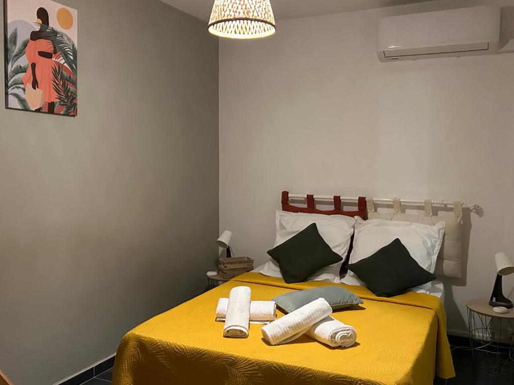 Postel nebo postele na pokoji v ubytování Appartement avec vue panoramique de Pointe-à-Pitre