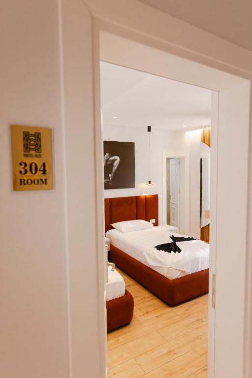 Postel nebo postele na pokoji v ubytování Hotel Olsi