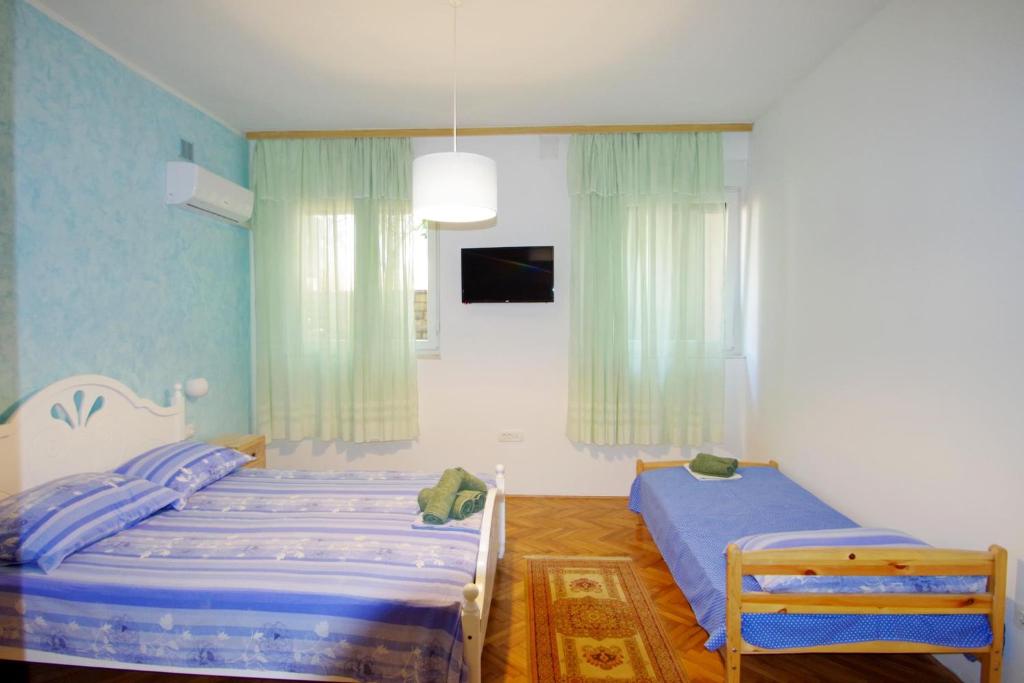 Postel nebo postele na pokoji v ubytování Apartman Gortanova uvala