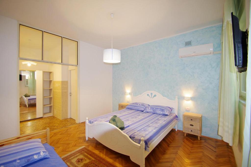 Postel nebo postele na pokoji v ubytování Apartman Gortanova uvala