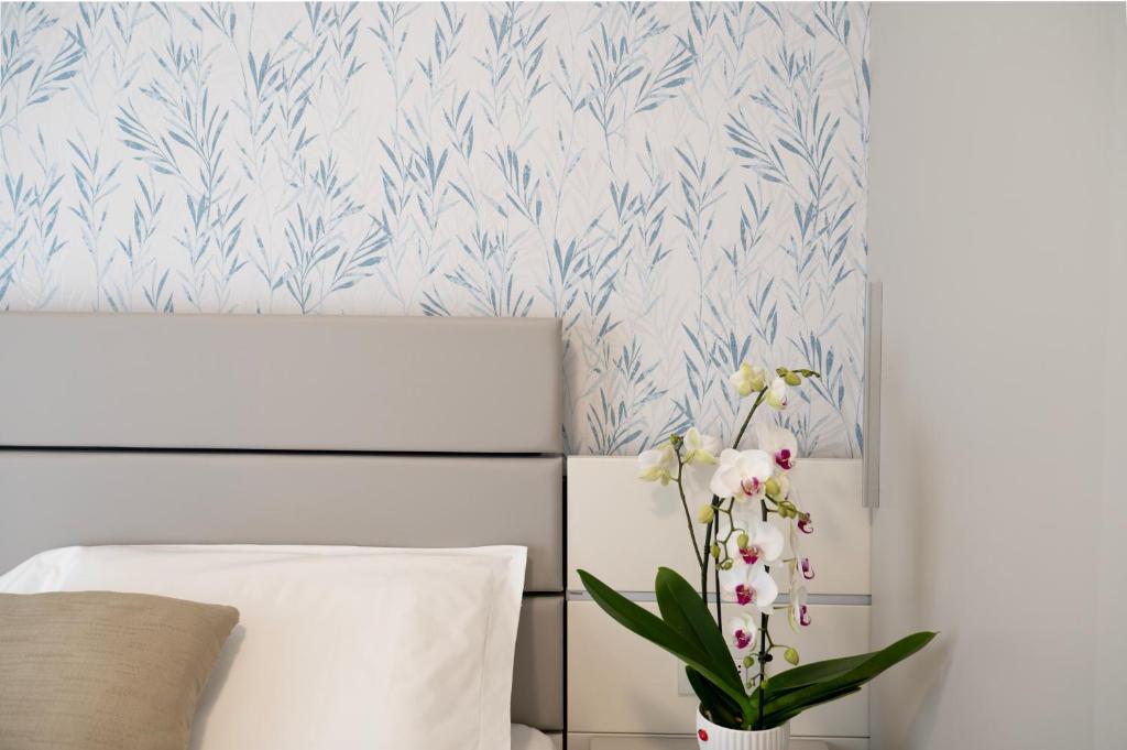 Postel nebo postele na pokoji v ubytování Hotel Astoria