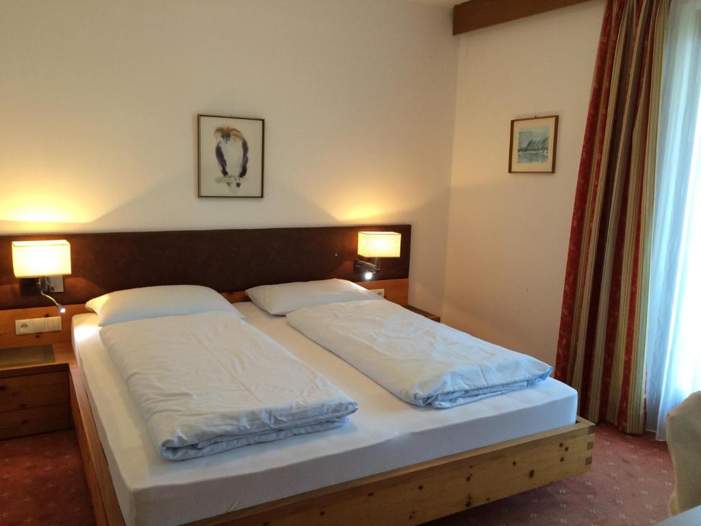 Postel nebo postele na pokoji v ubytování Hotel Garni Paler