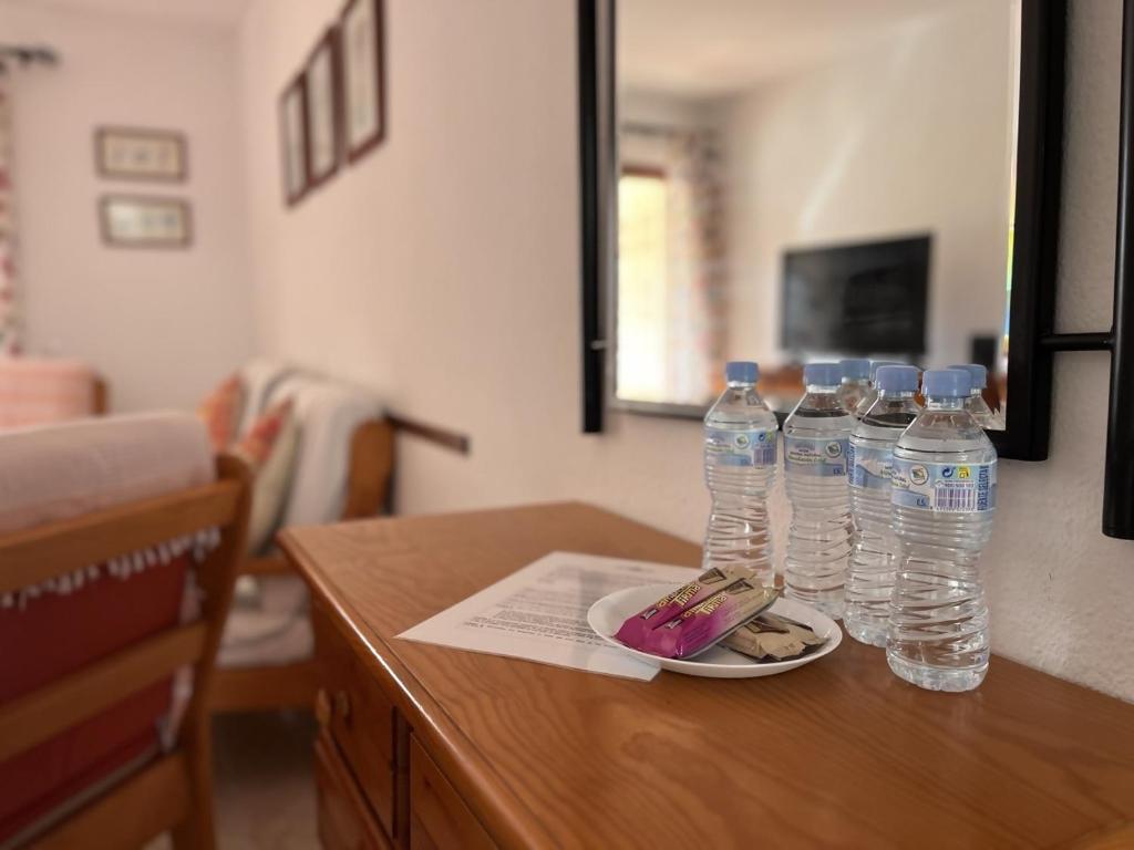 A television and/or entertainment centre at Vera Mar 5A Primera linea con Piscina y Parking