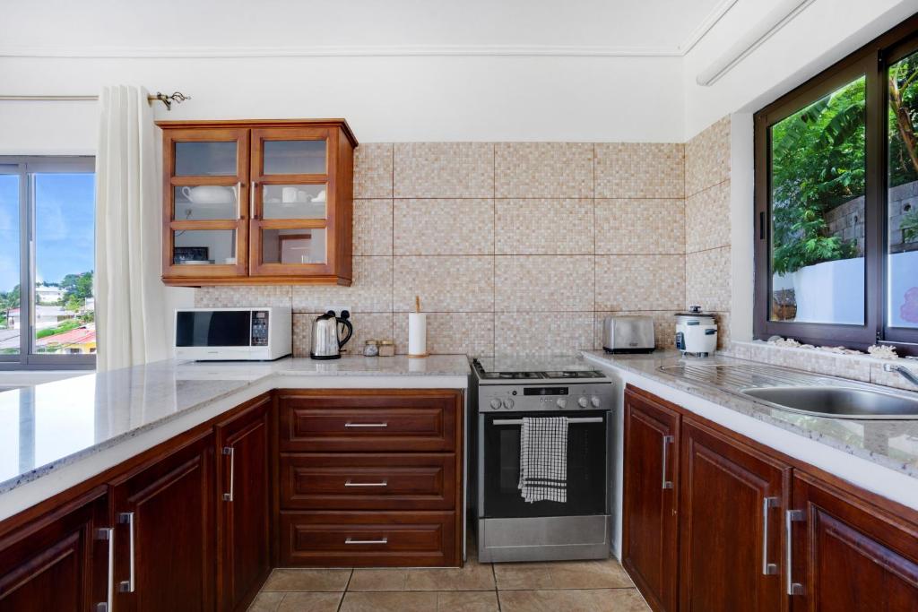 Kuchyň nebo kuchyňský kout v ubytování Dar & Douce Apartments