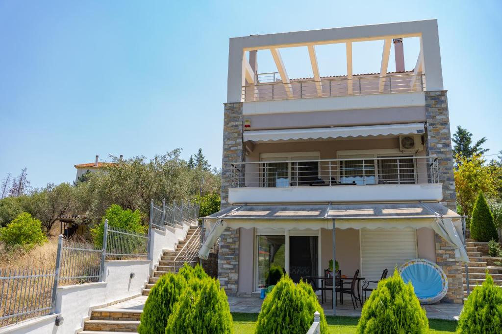a villa with a view of a house at Villa Brezza Di Mare - Agios Stefanos Volos in Kritharia