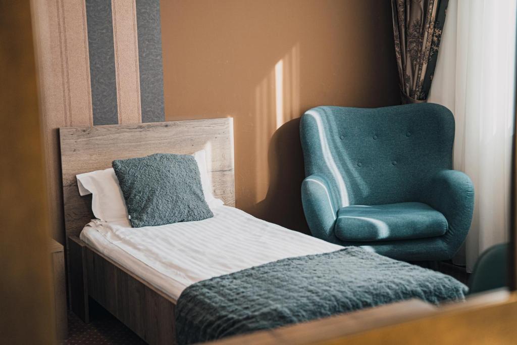Postel nebo postele na pokoji v ubytování Sky Hotel