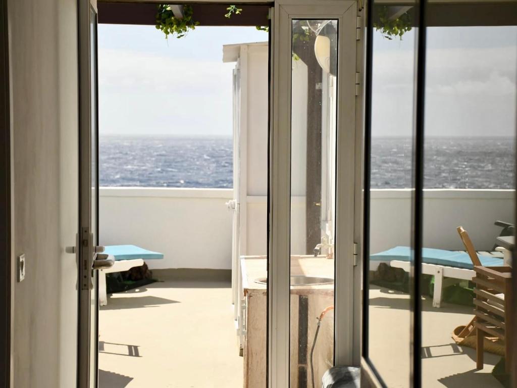 a view of the ocean from the balcony of a house at Penthouse Maines View in Pájara