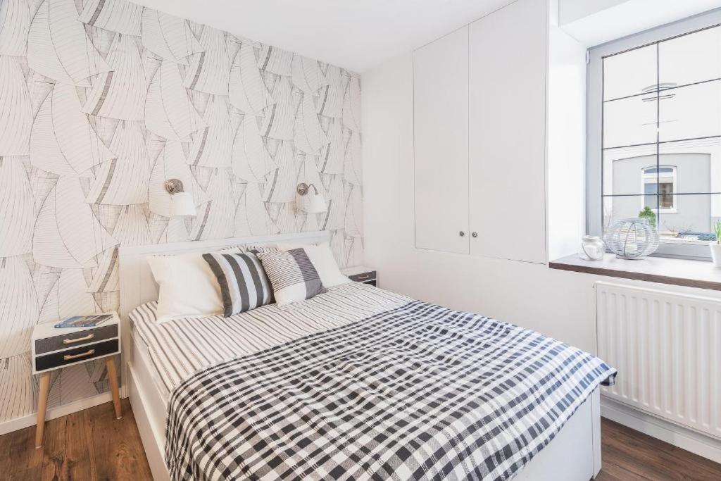 Posteľ alebo postele v izbe v ubytovaní Happy Stay Tartaczna Residence I