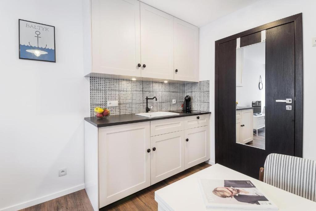 Kuchyňa alebo kuchynka v ubytovaní Happy Stay Tartaczna Residence I