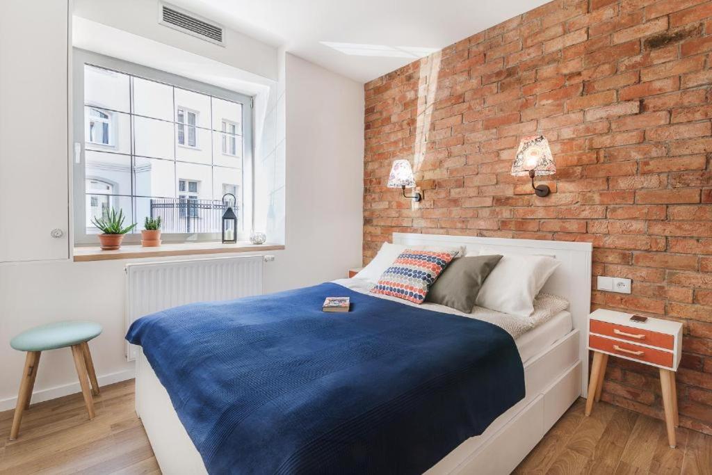 Posteľ alebo postele v izbe v ubytovaní Happy Stay Tartaczna Residence I