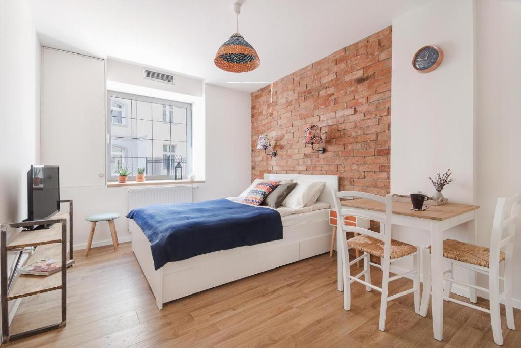 Posteľ alebo postele v izbe v ubytovaní Happy Stay Tartaczna Residence I