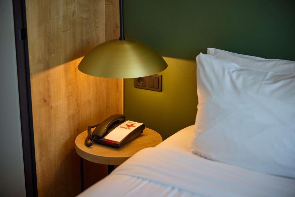 Postel nebo postele na pokoji v ubytování Hilton Garden Inn Leiden