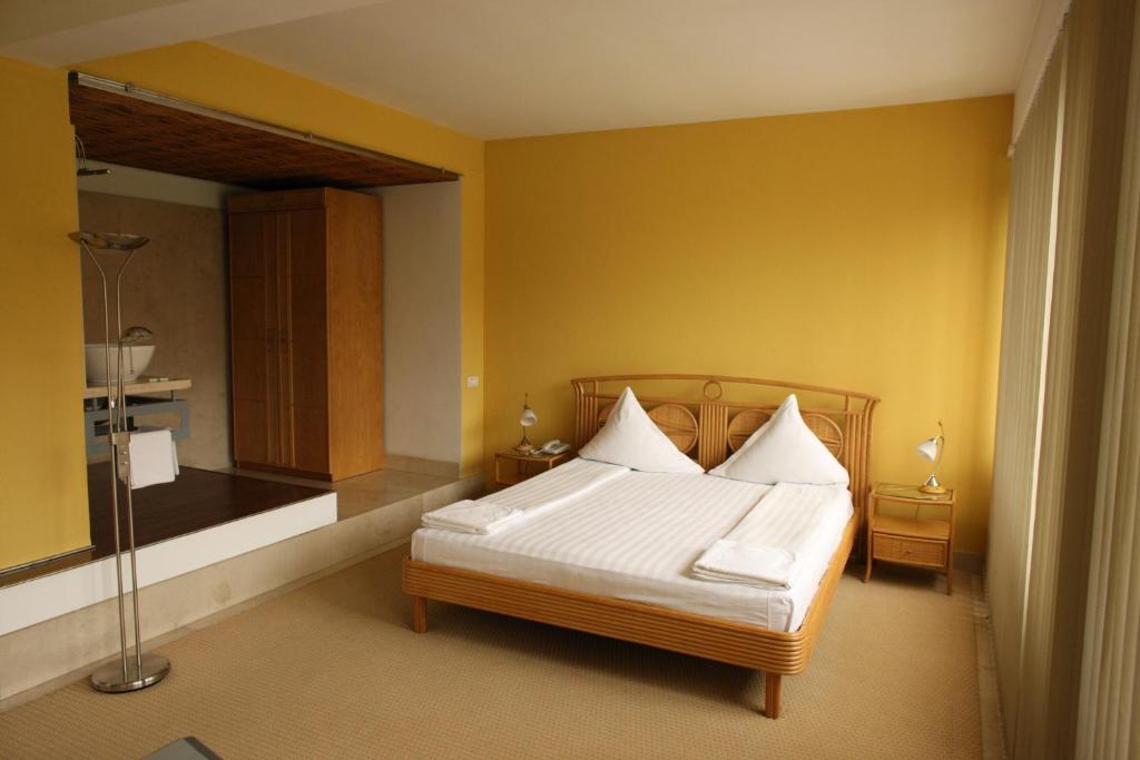 Posteľ alebo postele v izbe v ubytovaní Hotel Central