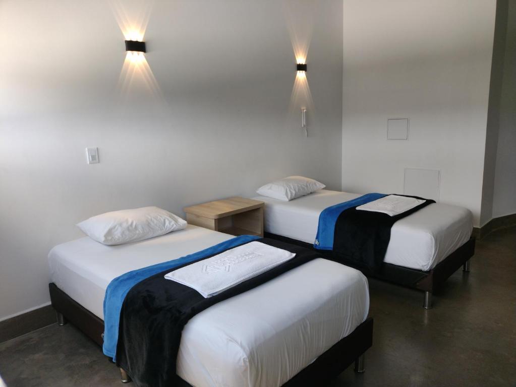 Postel nebo postele na pokoji v ubytování Hotel El Cordobes