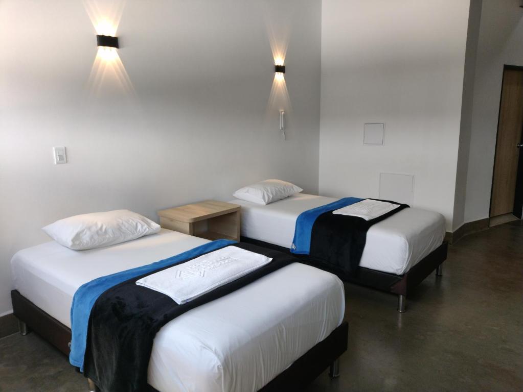 Postel nebo postele na pokoji v ubytování Hotel El Cordobes