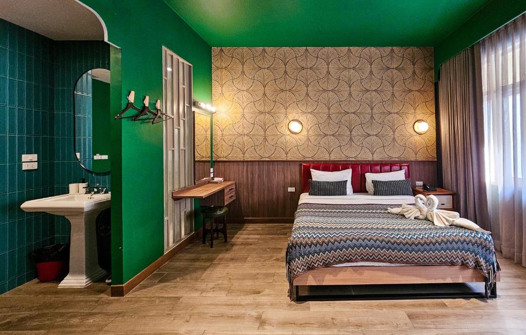 Postel nebo postele na pokoji v ubytování Miami Hotel Bangkok