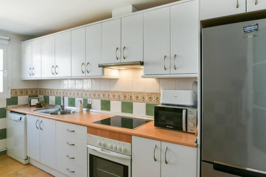 Kuchyň nebo kuchyňský kout v ubytování Increíble apartamento