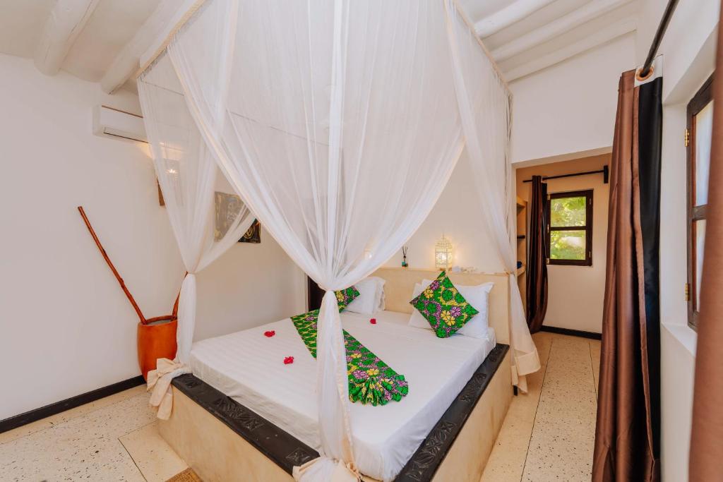 Postel nebo postele na pokoji v ubytování Daima Villas