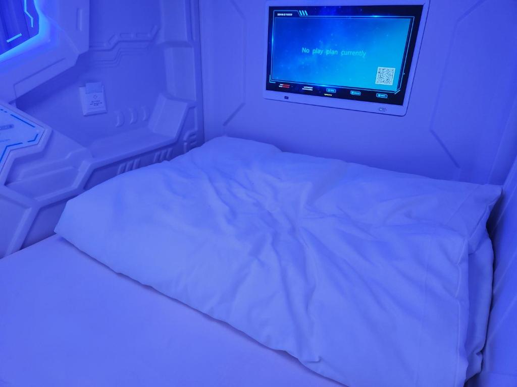 Postel nebo postele na pokoji v ubytování Hotel Galaxy Pod
