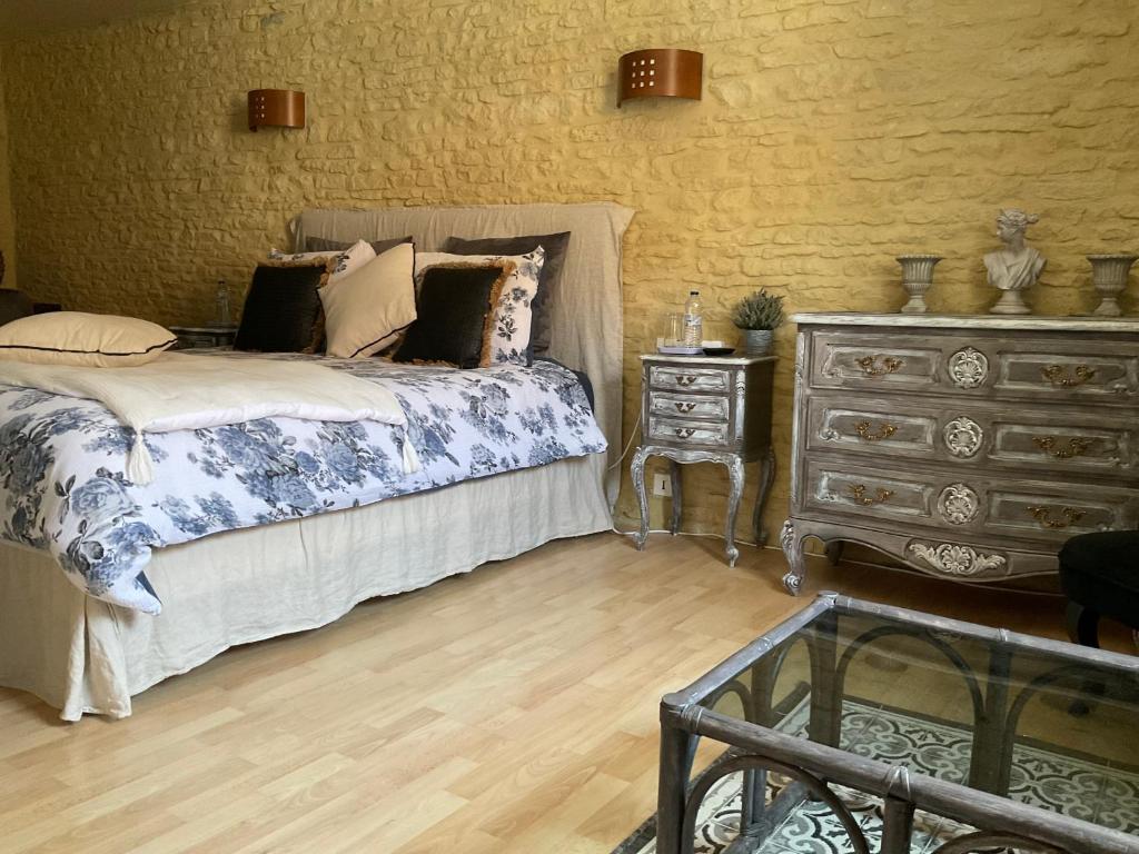 Postel nebo postele na pokoji v ubytování Chambres d’hôtes de l’Ancienne Auberge