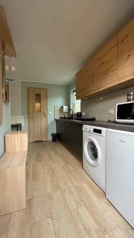 Kuchyň nebo kuchyňský kout v ubytování Apartament U Waldka