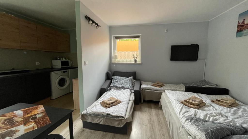 Postel nebo postele na pokoji v ubytování Apartament U Waldka
