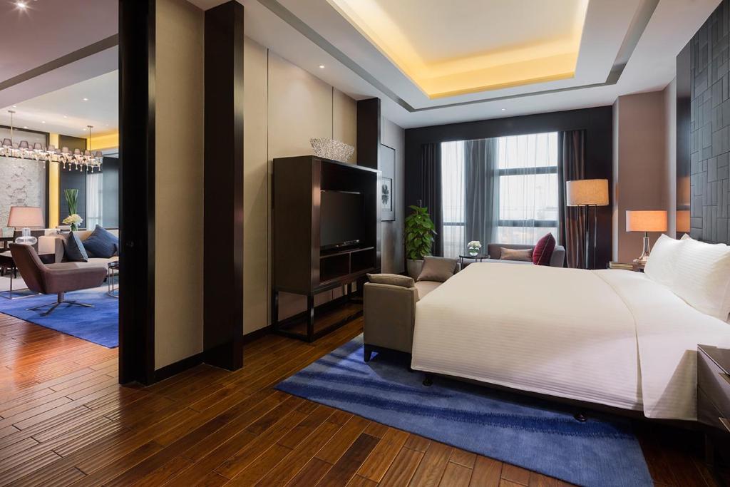 Letto o letti in una camera di Wanda Realm Wuhan