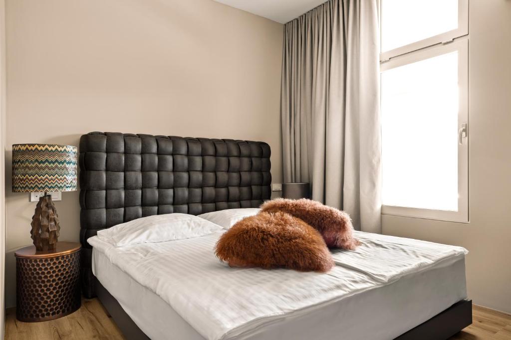 Postel nebo postele na pokoji v ubytování Hotel Harmonija SPA & FREE PARKING