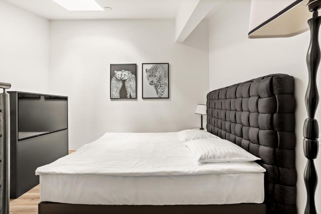 Postel nebo postele na pokoji v ubytování Hotel Harmonija SPA & FREE PARKING