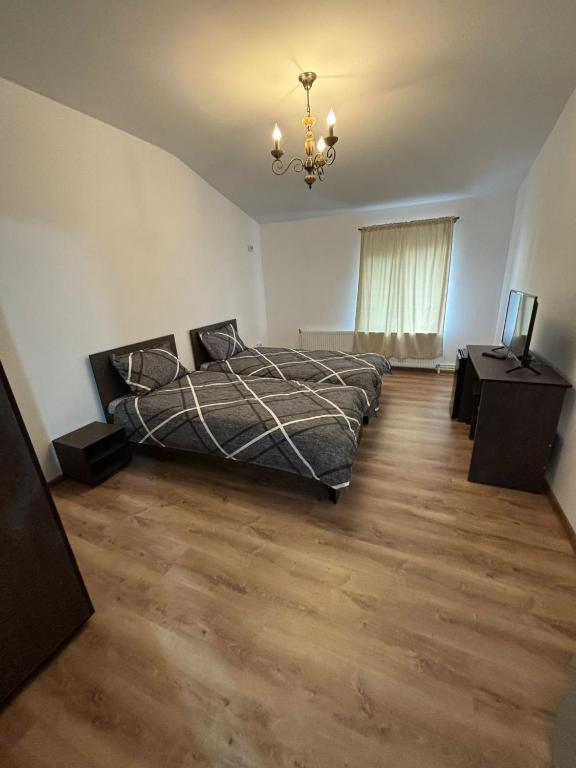 Postel nebo postele na pokoji v ubytování Alexander Residence