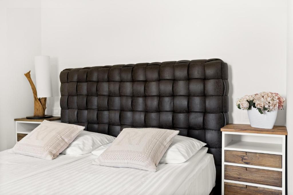 Postel nebo postele na pokoji v ubytování Hotel Harmonija SPA & FREE PARKING