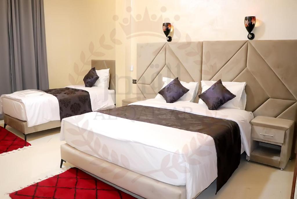 Postel nebo postele na pokoji v ubytování Hôtel AL QAISAR
