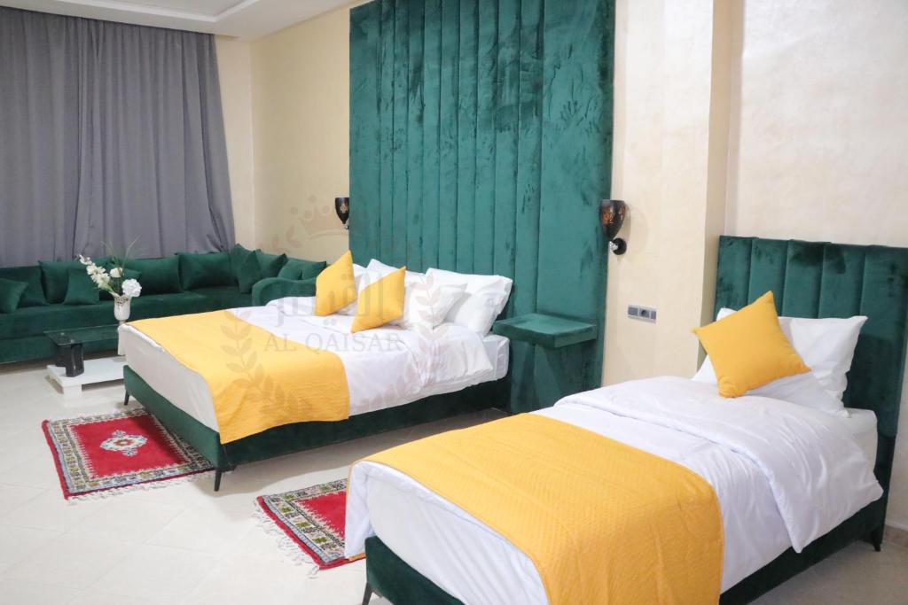 Postel nebo postele na pokoji v ubytování Hôtel AL QAISAR