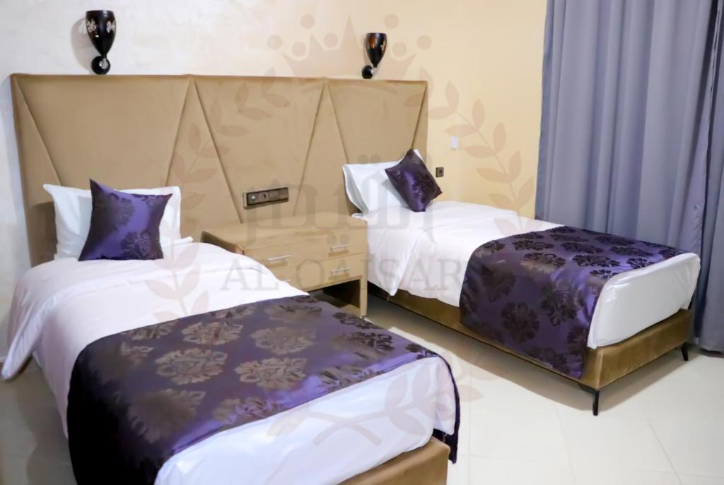 Postel nebo postele na pokoji v ubytování Hôtel AL QAISAR