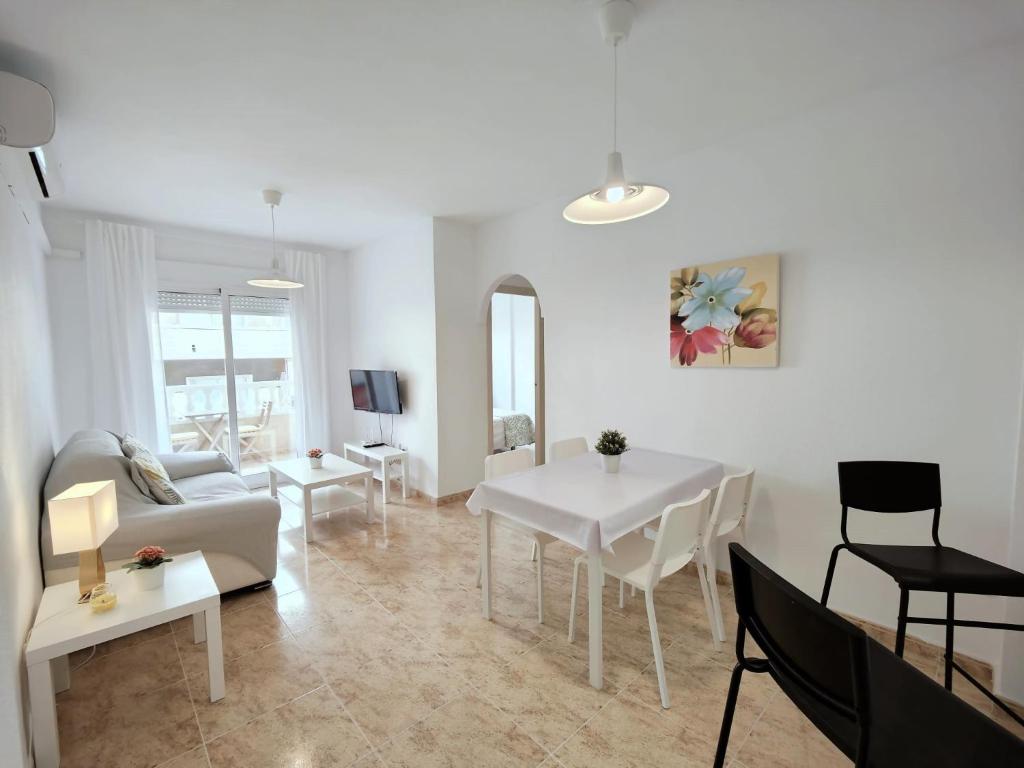 a living room with a couch and a table at Caballero de Rodas DaNuria in Torrevieja