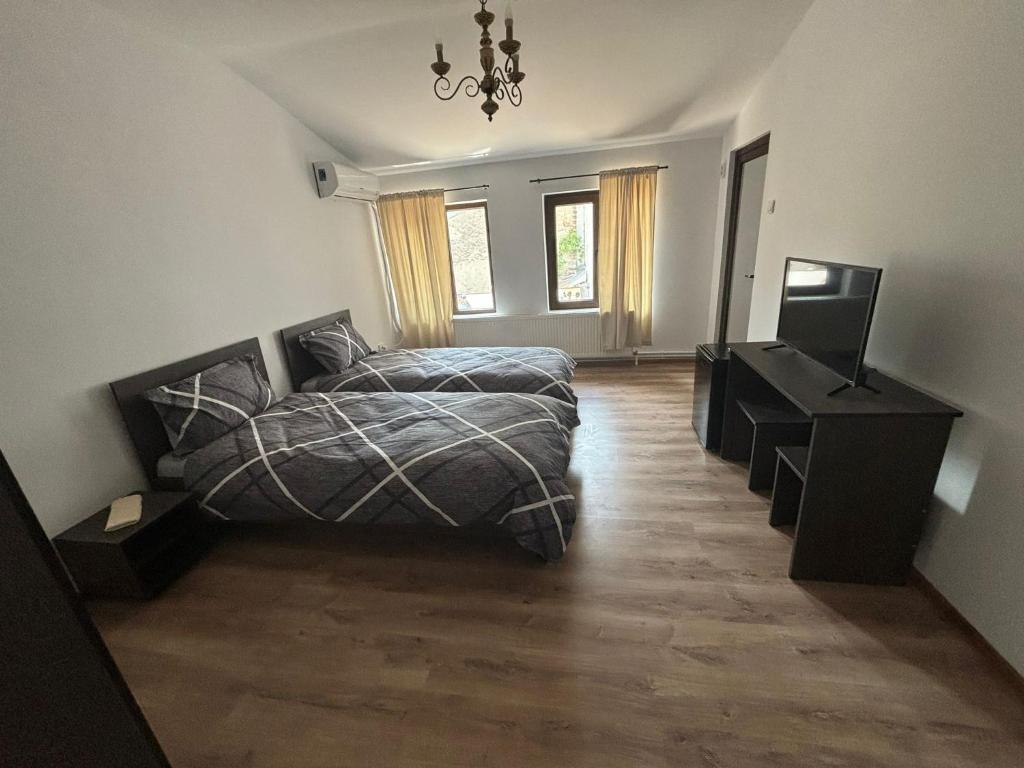 Postel nebo postele na pokoji v ubytování Alexander Residence